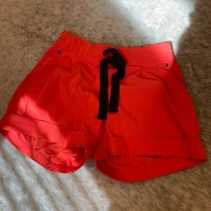 Lululemon Orange/Red shorts with black drawstring